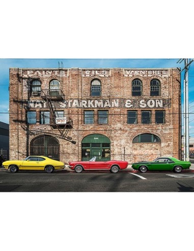 Paisaje urbano con muscle cars